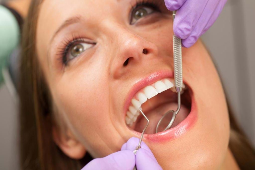A girl is showing there teeth